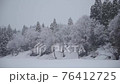 Snowstorm in a snowy country 76412725