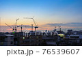 day to night timelapse of working crane at condo construction work at beautiful sunset time, Bangkok Thailand 76539607