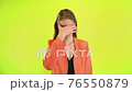 Woman face palm gesture in space studio on yellow background 76550879
