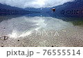 The stone are dropping in the lake water. Slow motion 76555514