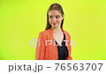 Cunning face woman expressions facial gesticulating hands in space studio 76563707