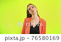 Yawing woman bored at work thinking home in space studio 76580169