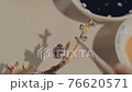Paint the woodcraft with colors. Hobbies and creativity, handmade. The artist draws on a wooden toy. Chinese style, Art, paintbrush, creation. 4K and close-up.  76620571