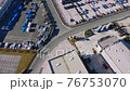 Drone flying above a lot of new cars 76753070
