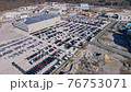 Drone flying over a lot of new cars 76753071