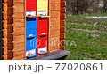 Honey bees flying near the wooden hive. Apiculture 77020861