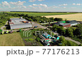 summer landscape With field, road and trees in Russia 77176213
