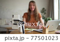 Woman talk for social media video, defocused. Influencer recording blog podcast on smart phone 77501023