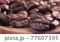 Coffee on grunge wooden background, close up 77607395