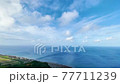 [Okinawa material] A cut of the blue sea from the hill where butterflies dance toward the sky 77711239