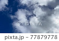 Time lapse with white clouds flowing in the clear sky 77879778