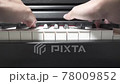 Hands of a man practicing the piano 78009852