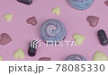Exquisite delicious handmade chocolates confectionary rotating on pink table 78085330