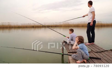Skillful Arab Teenage Boy with Fishing Rod Enjoying Fishing From