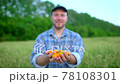 Farming and cultivations. Portrait of man farmer showing vegetables, tomato, Farmer's market, tomatoes cherry, Organic Farming, Farm Harvest, Crop, grow vegetables, natural clean fresh product 78108301