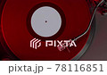 Red vinyl record spins on turntable playing modern misic albums in analog sound 78116851