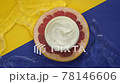 Jar with moisturizing cream on piece of fresh grapefruit in clean water splash 78146606