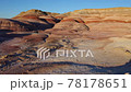 Drone flies low over moonscape red rocks in Utah, USA 78178651