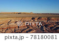 Beautiful sunrise aerial of red striped rock formations Central Utah 78180081