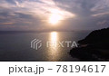 [Drone aerial photography] Aerial view of a scene flying from the setting sun of Okinawa toward the front 78194617