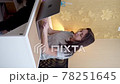 Young woman tired of work and playing pop it. Vertical video 78251645