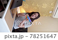 Woman has video call conversation and shows pop it toy. Vertical video 78251647