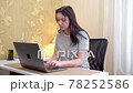 Young woman tired of work and playing pop it 78252586