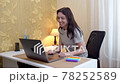 Woman has video call conversation and shows pop it toy 78252589