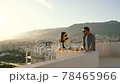 Couple picnic on the roof spending quarantine leisure time 78465966