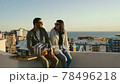 Couple picnic on the roof spending quarantine leisure time 78496218