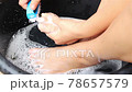 Lady Cleaning Foot in the Tray 78657579