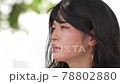 A woman looking at one point 78802880