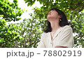 A woman looking up at the sky 78802919