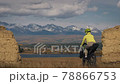 The woman travel on mixed terrain cycle touring with bikepacking. The traveler journey with bicycle bags. Sport tourism bikepacking. The woman travel on mixed terrain cycle touring with bikepacking. The traveler journey with bicycle bags. Sport tourism bikepacking. 78866753