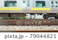 The train passes. Run on the railroad tracks. Slow motion. Japanese landscape. 79044821