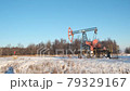 oil pump drilling rig or rocking machine against the blue winter sky. Cold, harsh winter and lots of snow . Oil industry in Russia and Norway. crude oil prices concept. 79329167