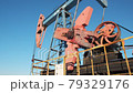 oil pump drilling rig or rocking machine against the blue winter sky. Cold, harsh winter and lots of snow . Oil industry in Russia and Norway. crude oil prices concept. 79329176