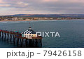 Drone circling around Imperial Beach Pier, San Diego California 79426158