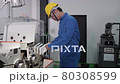 An Asian male Technician / Engineer is inspecting and repairing machines in the factory. Engineering and industrial concept.	 80308599