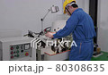 An Asian male Technician / Engineer is inspecting and repairing machines in the factory. Engineering and industrial concept.	 80308635
