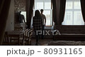 Young couple man and woman stay near window at home. Happy young lovers enjoy time spending together at home 80931165