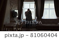 Young couple man and woman stay near window at home. Happy young lovers enjoy time spending together at home 81060404