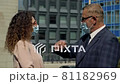 Colleagues bumping elbows to say hello outdoors. Welcome gesture during a pandemic. Personal safety concept. 81182969