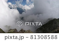mountain peak in the clouds, climbing to the top, panorama of nature, day 81308588