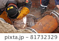 Welder worker welding pipe by electrode. close-up 81732329