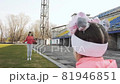Little daughter is looking at mother jumping rope 81946851
