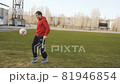 Man playing football alone 81946854