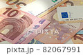 A big pile of euro banknotes. Many Euro bills lie on top of each other. Bunch of money of the European Union. Currency of the united Europe. Cash balance of the European Central Bank or ECB. 82067991