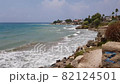 Picturesque seaside of the city of Side in Turkey. A steep cliff and waves hitting the stones. 82124501