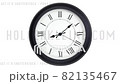 Close-up time lapse of a  old-fashioned antiquated wall clock with roman numerals on the clock face in endless loop. Antique watch on a white background. Endless loop footage. Clock turns  82135467